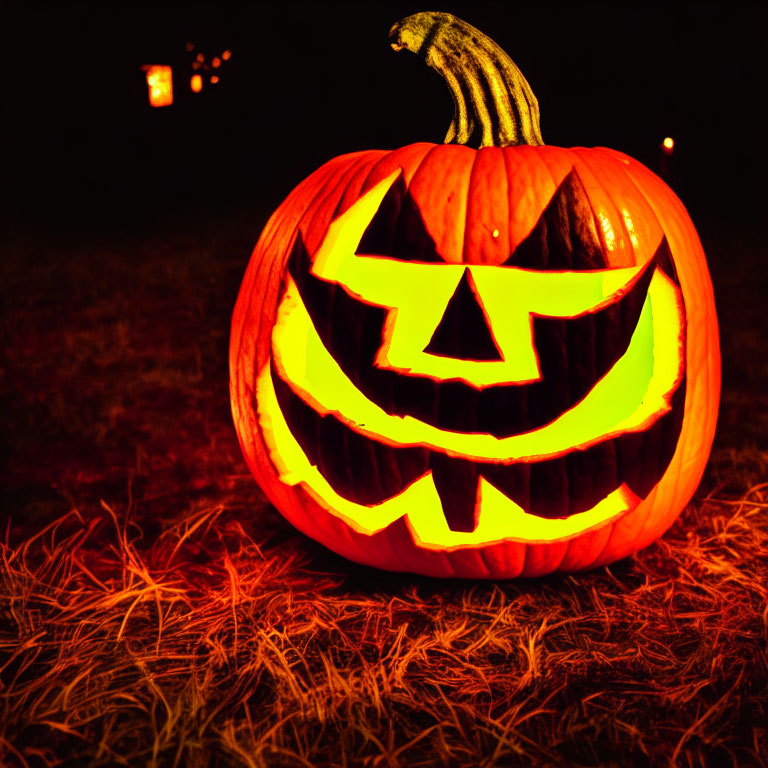 Carved smiling jack-o'-lantern glowing at night