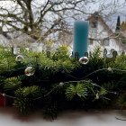 Blue Candle on Wooden Mantle with Winter Scene