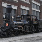 Detailed Vintage Black and White Steam Locomotive on Tracks