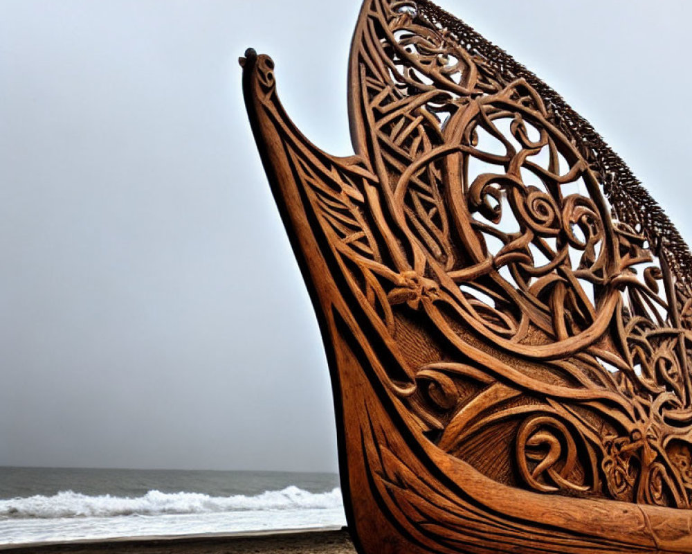 Intricately Carved Viking Ship Sculpture on Sandy Beach