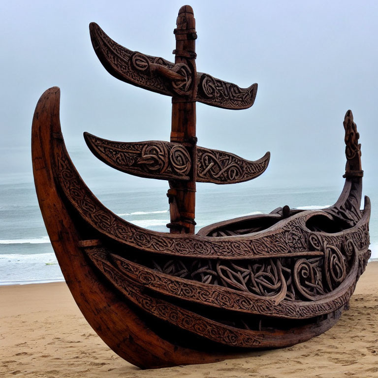 Ornate Wooden Boat with Carved Designs on Sandy Beach