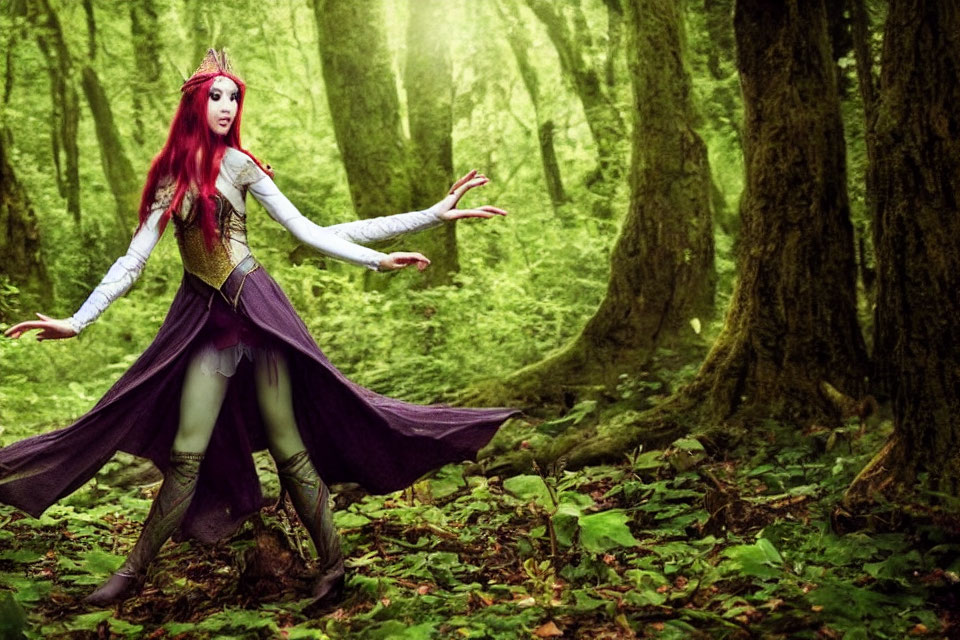Person in fairy tale costume with red wig posing in lush green forest